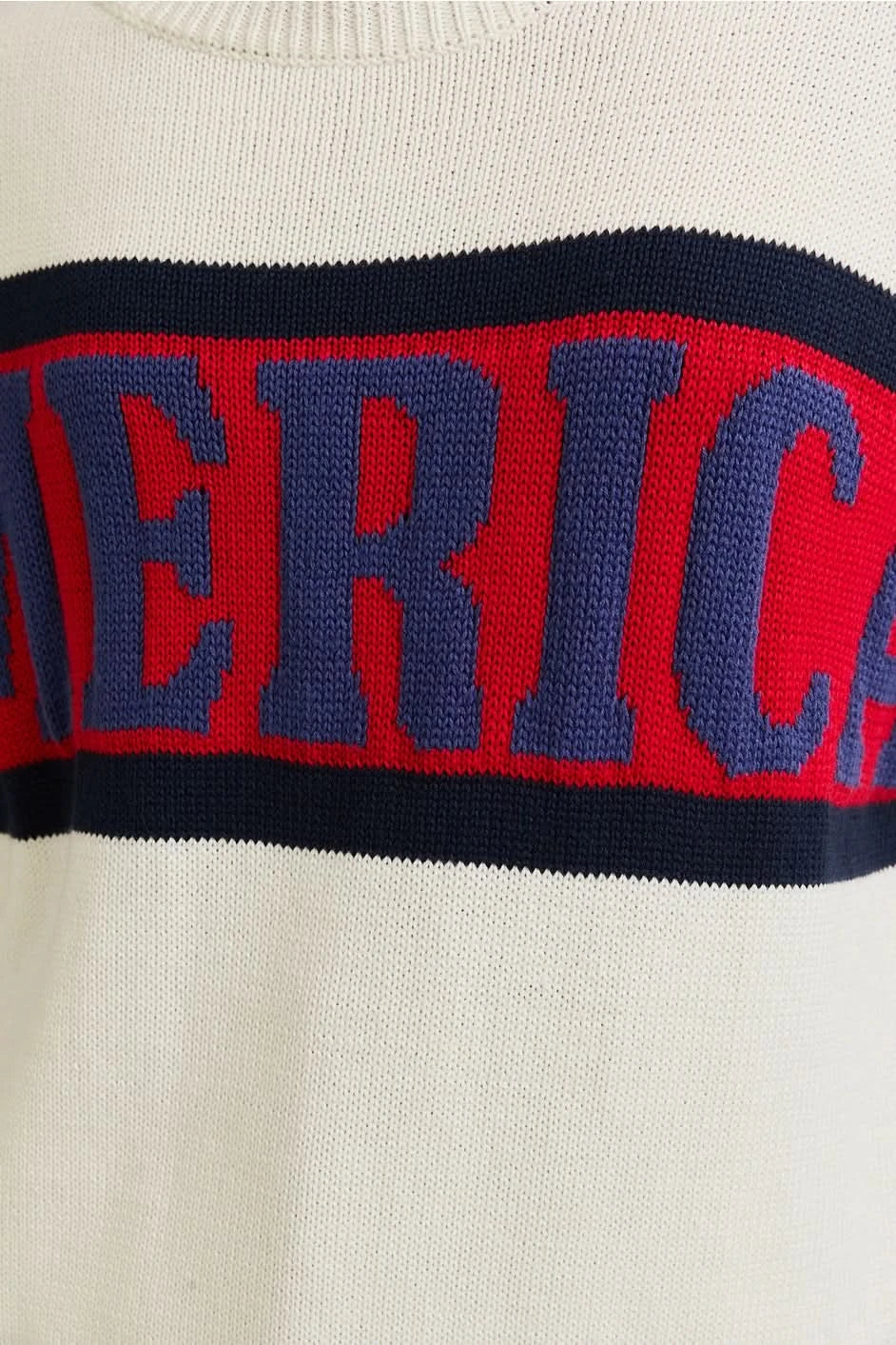 Woman wearing a patriotic AMERICA knit sweater in Red, White , and Blue . Perfect for Memorial Day